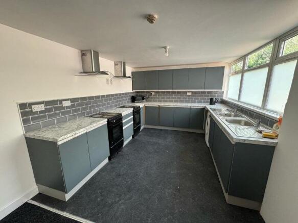 Bright and modern kitchen with ample countertop...