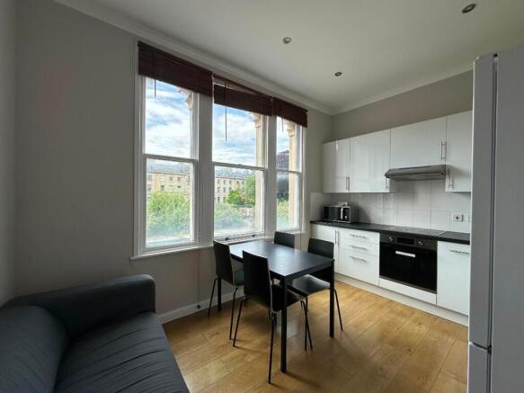 Bright and modern kitchen featuring ample count...