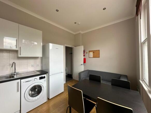 This inviting kitchen area features modern appl...