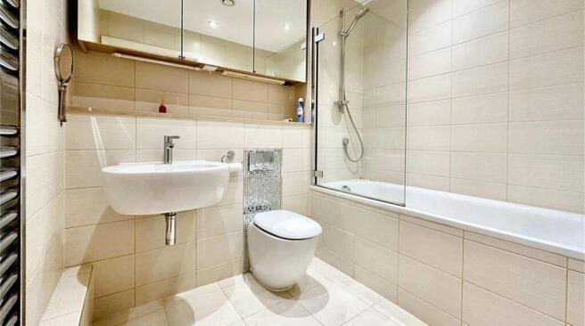 A modern, well-maintained bathroom featuring a ...