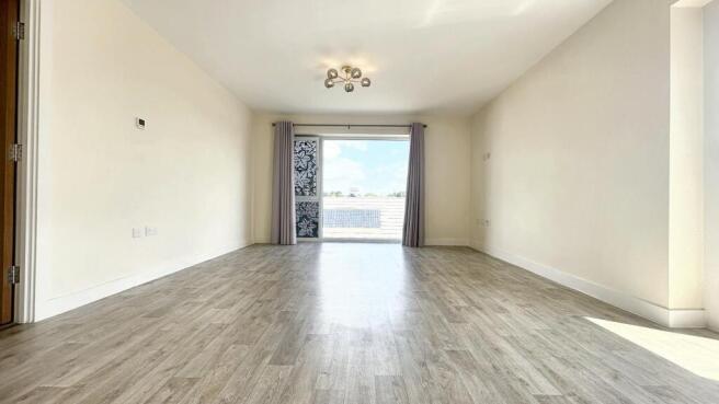 Bright and spacious living room featuring clean...