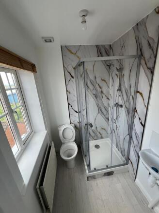 Bright and modern bathroom featuring a stylish ...