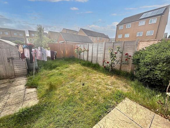A bright and inviting garden space with a well-...