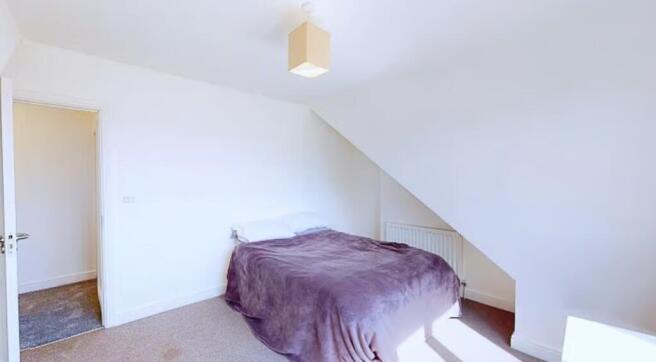 Bright and inviting double bedroom featuring a ...