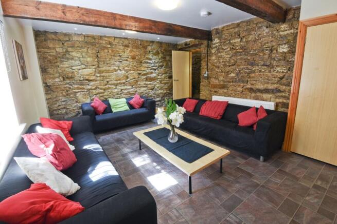 A cozy and stylish living room featuring expose...