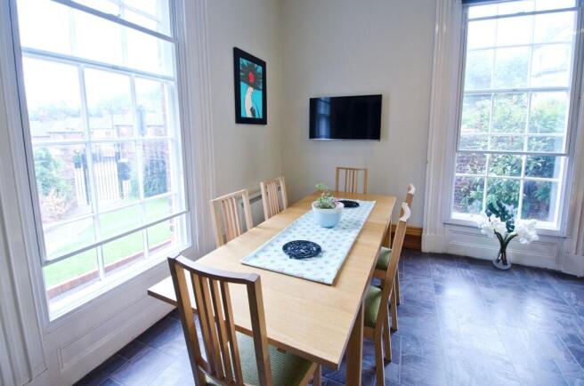 A bright and welcoming communal lounge featurin...