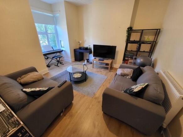 Bright and cozy living room featuring two comfo...