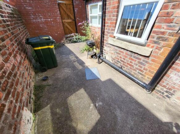 A charming and private outdoor garden space wit...