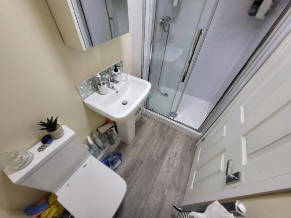 A modern bathroom suite featuring a clean white...