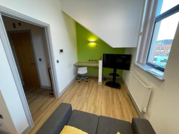 A bright and clean communal lounge featuring mo...