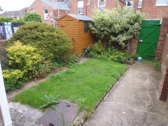 A charming and well-maintained garden space fea...