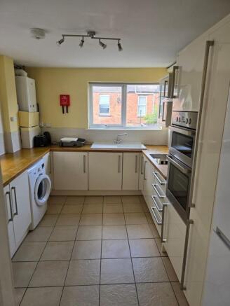 Bright and clean kitchen featuring modern appli...