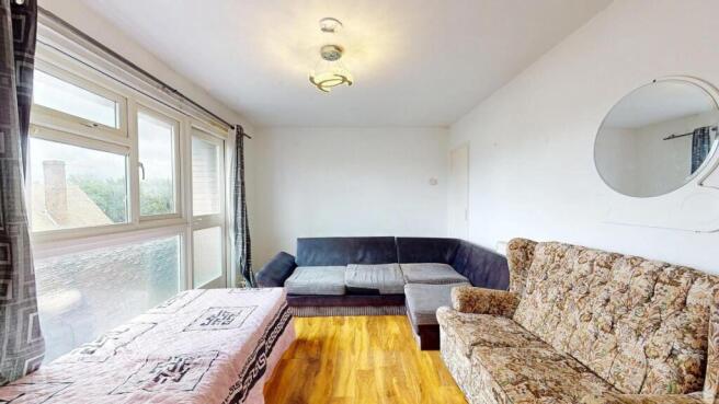 Bright and welcoming living room featuring larg...