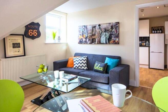 Bright and inviting living room featuring a com...