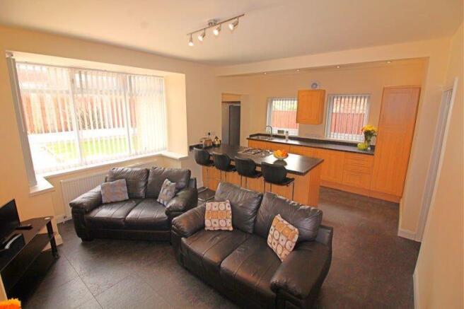 Bright and inviting open-plan living room with ...