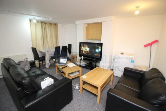 A comfortable and functional living room featur...