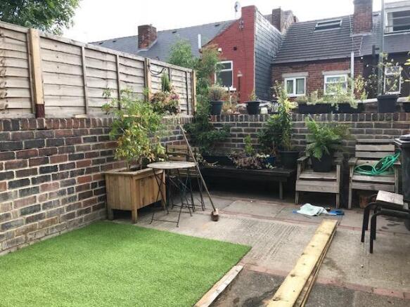 A charming and well-maintained garden space fea...