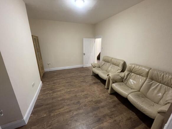 A spacious and inviting living room featuring c...