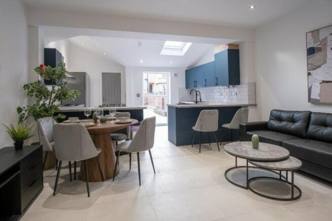 A stylish and modern living area featuring a co...
