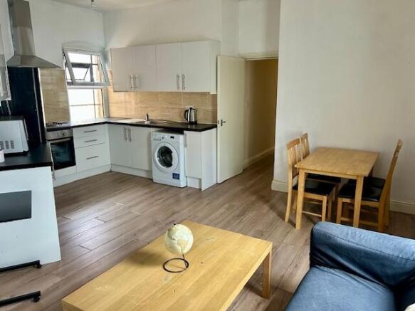 Bright and modern kitchen featuring a sleek bla...