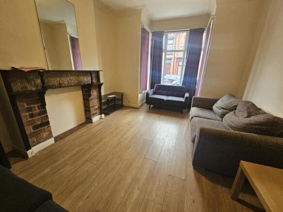 Bright and welcoming living room with large win...