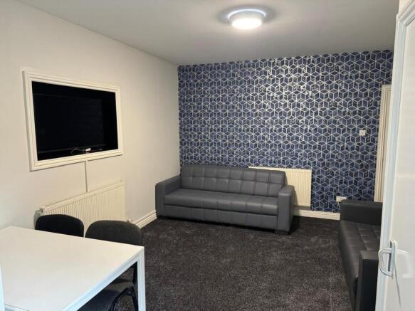 A modern and inviting living room featuring sty...