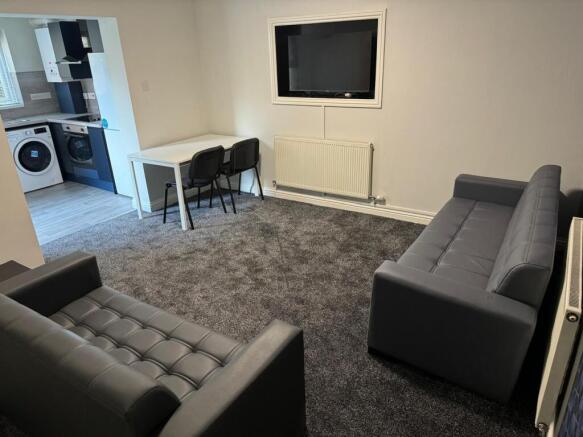 A stylish and inviting living room featuring co...