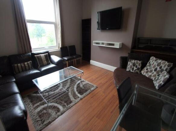 A comfortable living room featuring a large win...