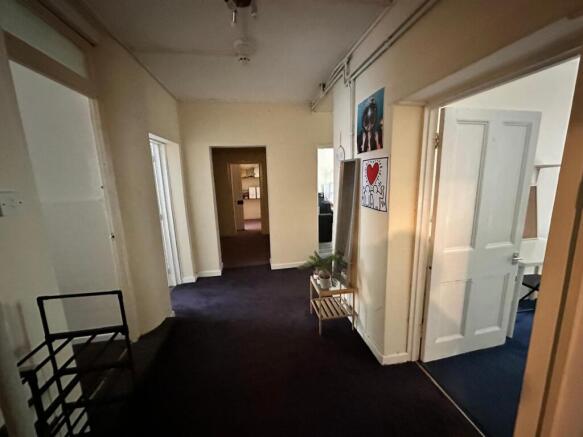 A well-maintained and spacious hallway that con...