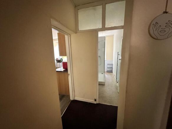 A functional hallway leading to various areas o...