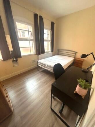 Bright and tidy single bedroom featuring two la...