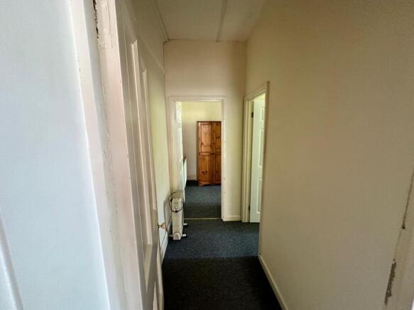 A tidy hallway leading to well-maintained rooms...