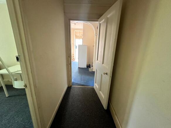 A well-maintained hallway leading to other room...