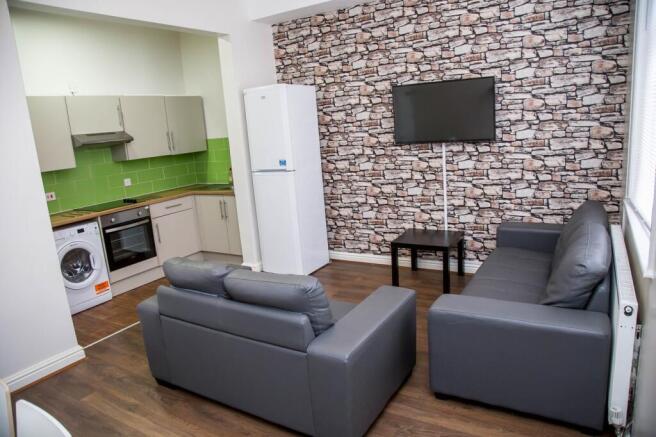 This contemporary living room features a stylis...