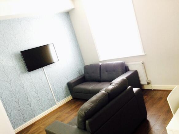 A bright and inviting living room featuring mod...