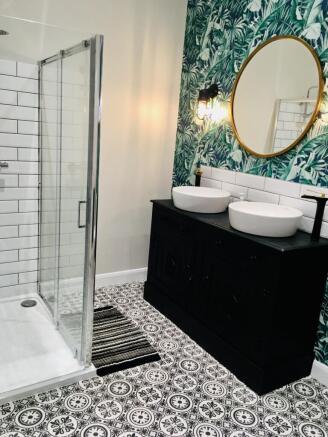 Experience a luxurious bathroom suite featuring...