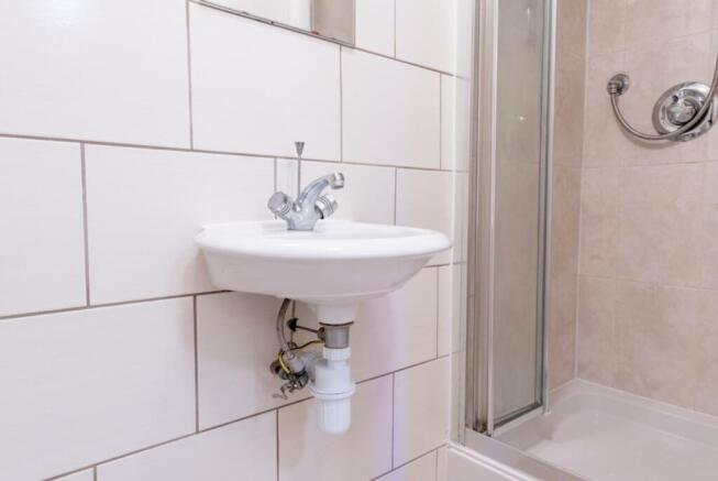 A well-maintained bathroom featuring a clean si...