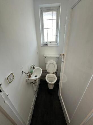 Compact and functional toilet room featuring a ...