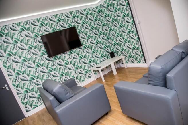 A stylish living room featuring modern furnitur...