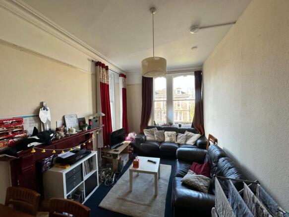 Bright and inviting living room featuring a spa...