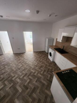 A modern kitchen featuring a stylish herringbon...