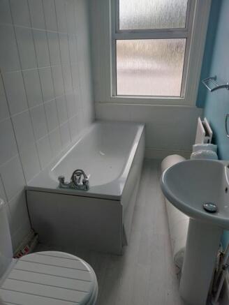 Bright and functional bathroom featuring a spac...