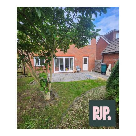 A spacious and well-maintained garden area, per...