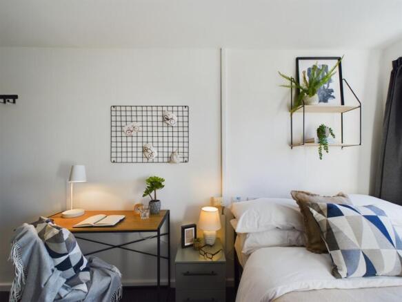 A stylish and inviting double bedroom featuring...