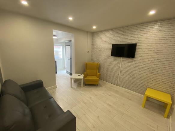 A modern living room featuring a cozy seating a...