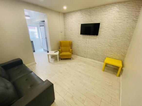 A stylish living room featuring a comfortable b...