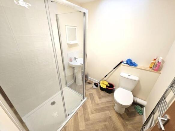 Bright and clean bathroom featuring a modern wa...