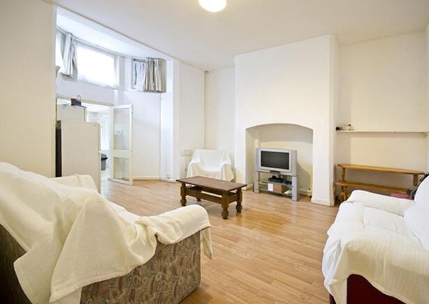 A spacious and inviting living room, perfect fo...