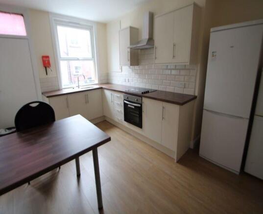 Bright and modern kitchen featuring ample count...