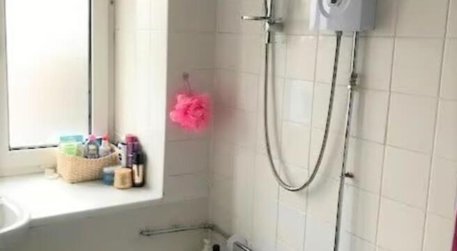 Bright and tidy bathroom suite featuring a larg...